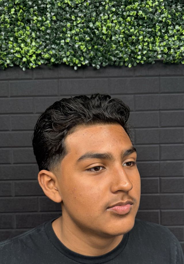 Textured wavy top with a clean low taper